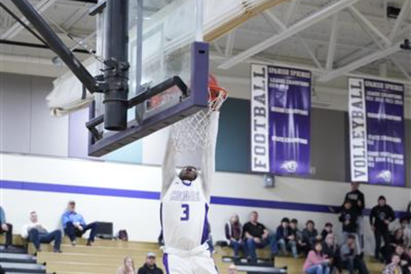 A Spanish Springs Boys Basketball making a jumpshot into the hoop.