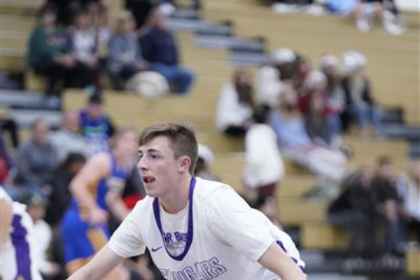 A closeup of a Spanish Springs Boys Basketball player making a concentrated face.
