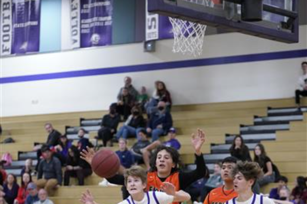 Spanish Springs Boys Basketball team and Wooster High Boys BAsketball team both going for the ball at Spanish Springs Court.