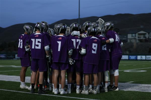 Spanish Springs boys lacrosse team group huddle