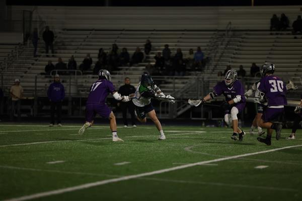 Lacrosse boys fighting for the ball